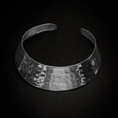 KIWA jewellery brand product image of a single silver plated necklace called the Ishtar choker, set on a dark granite background with no decoration