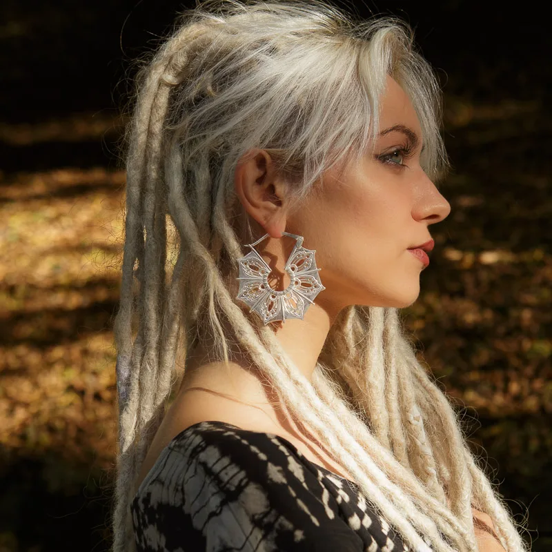 Photo of a Female model Yefimiya wearing Gaia Silver plated Earrings from KIWA Jewellery handcrafted designs